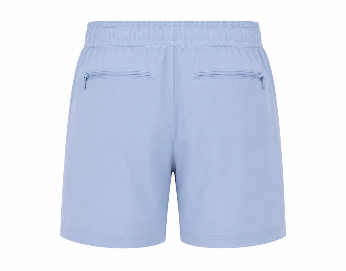 Light blue athletic shorts shown from the back, featuring an elastic waistband and two zippered pockets.
