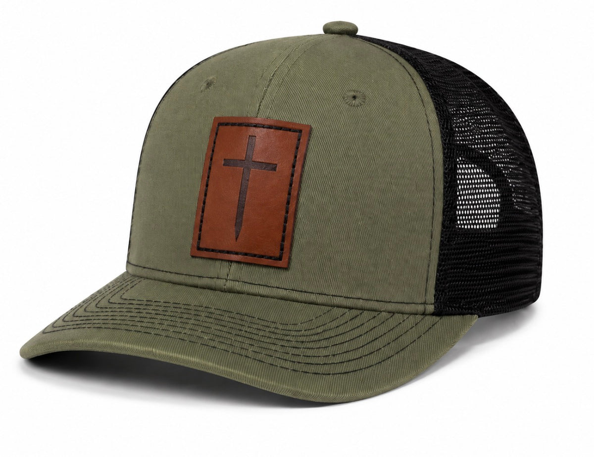 Green and black trucker hat with brown leather cross patch, side view – ETRNL Apparel Cornerstone Hat