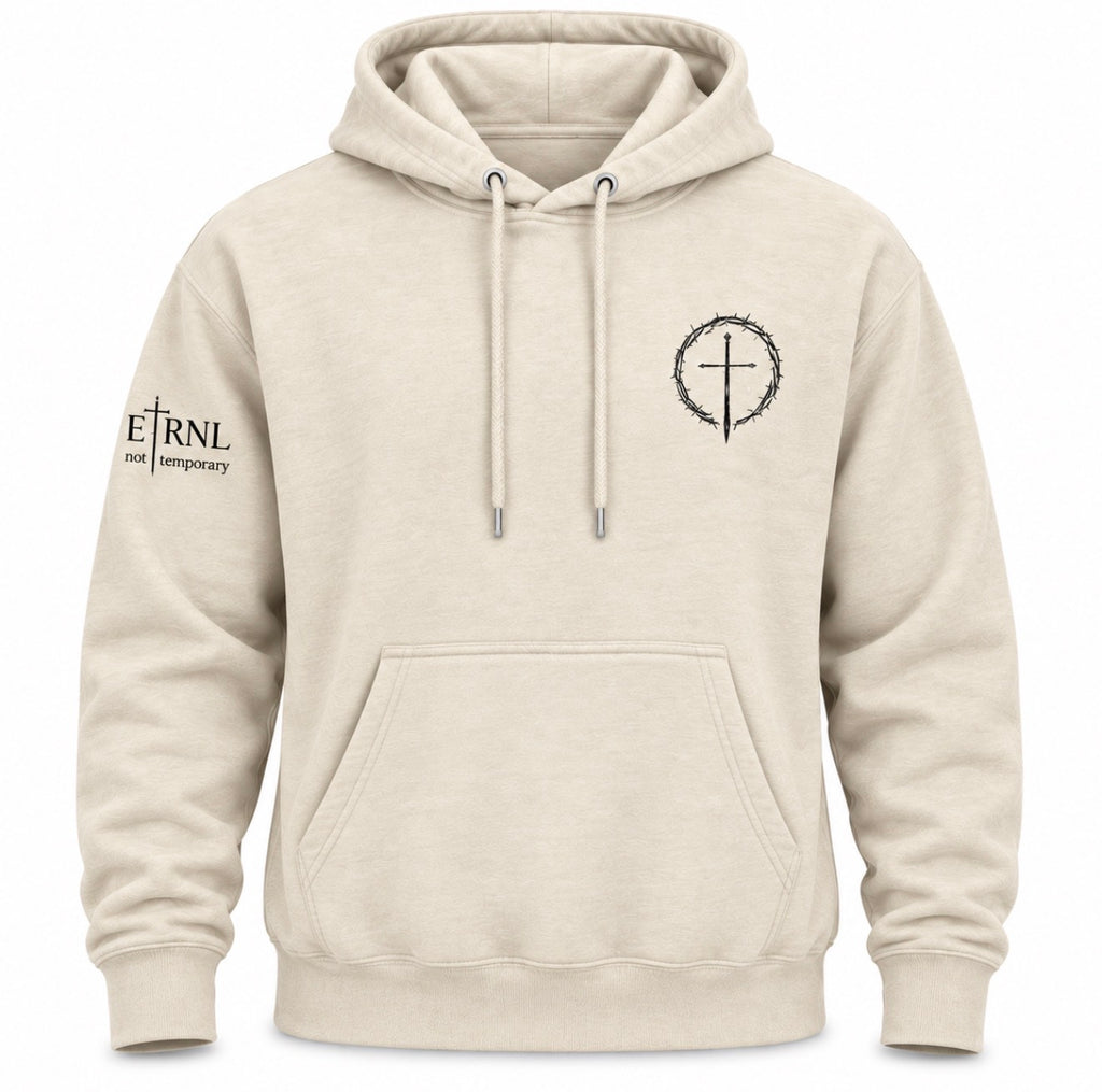 A beige pullover hoodie with a front kangaroo pocket, drawstrings, a black circular cross graphic on the left chest, and black text on the right sleeve reading 'ETRNL - Not Temporary'.